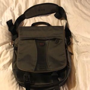 Green Tumi crossbodie messenger bag